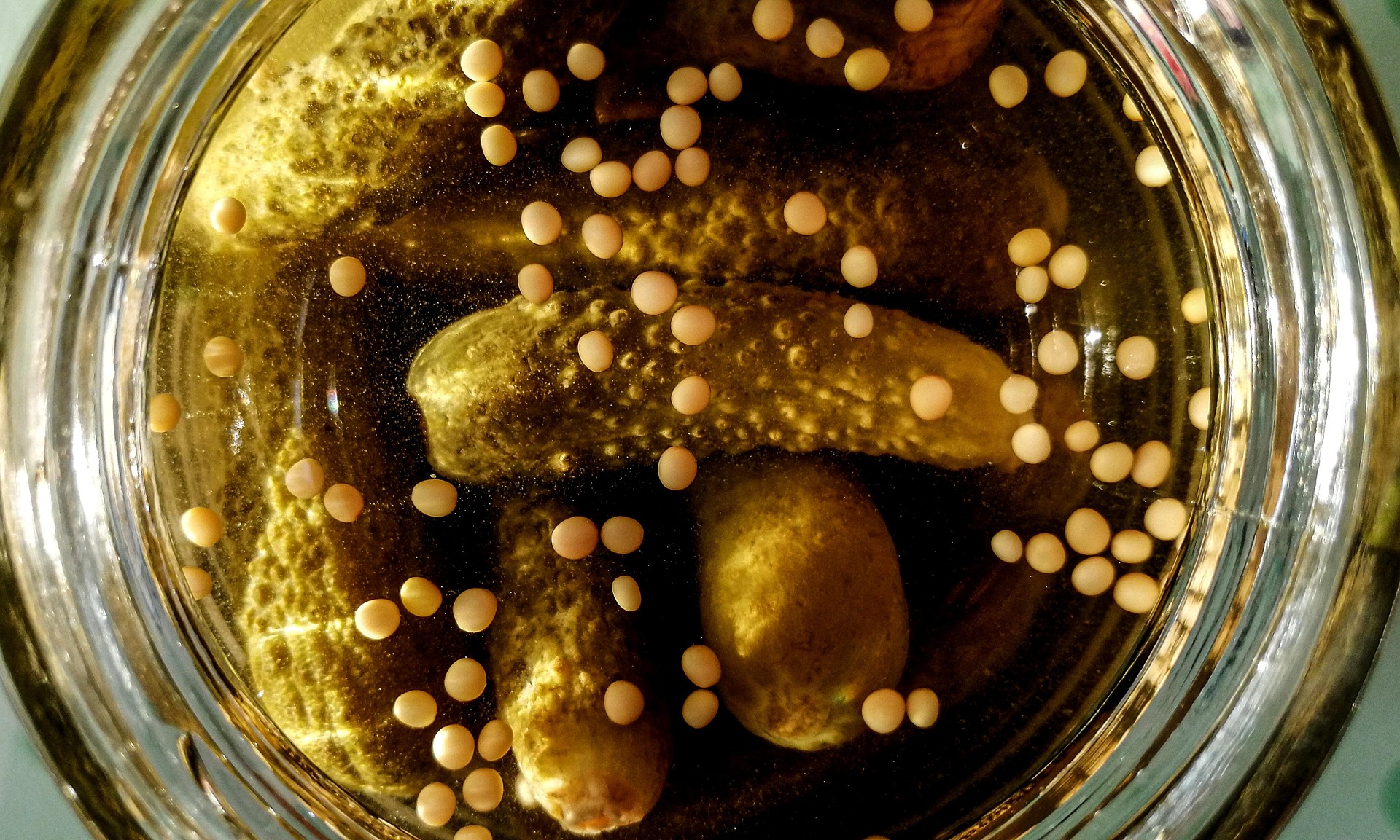 Pickled mustard seeds in a jar with spices